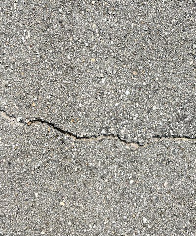 Close-up of concrete repair work showing durable materials being applied.